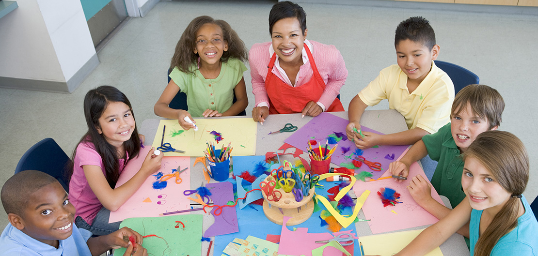 Image of group of children making arts and crafts