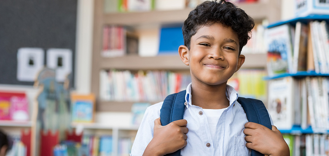Image of smiling child in school