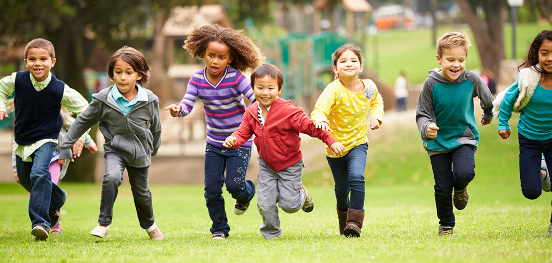 Image of children running on a playground